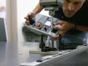 Michigan Scientific employee measures rounded part using Zeiss CMM